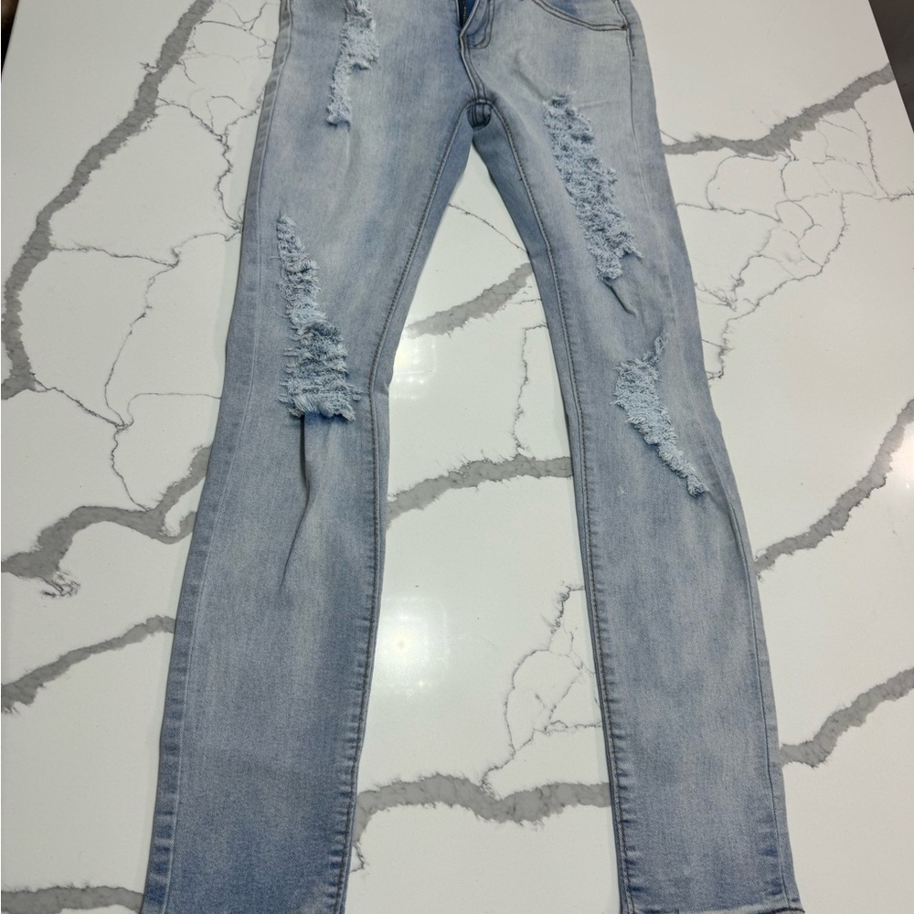 Women ripped blue jeans